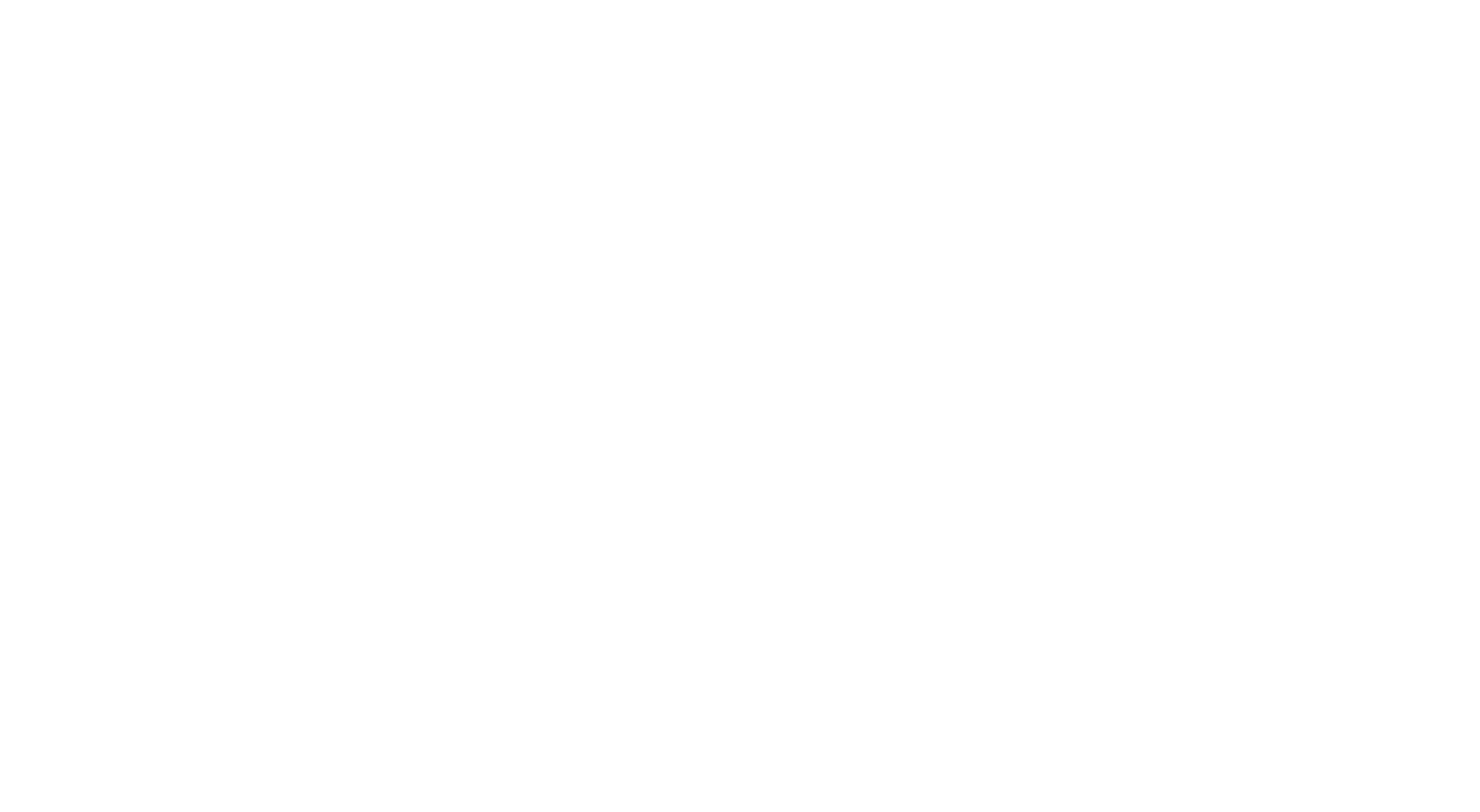 A person points to an open notebook while a robot writes in it.